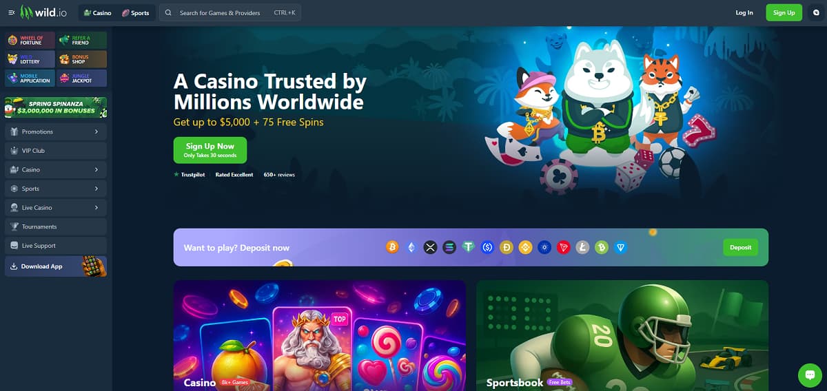 Wild.io inicio con banner que ofrece hasta 5.000 US$ y 75 giros gratis. Navegación incluye casino, deportes y torneos, con diseño oscuro y mascotas animales rodeadas de fichas y cartas.